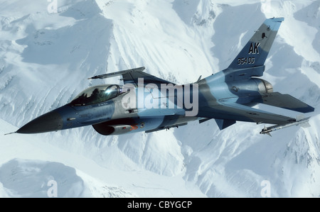 An F-16 Fighting Falcon and an aggressor disconnects from a KC-10 Extender after being refueled during Red Flag-Alaska April 22 over Alaska. The Joint Pacific Alaskan Range Complex provides 67,000 square miles of airspace, one conventional bombing range and two tactical bombing ranges containing more than 400 different types of targets and more than 30 threat simulators, both manned and unmanned. The F-16 is assigned to the 18th Aggressor Squadron from Eielson Air Force Base, Alaska. Stock Photo