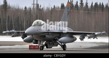 An F-16 Fighting Falcon from the Iowa Air National Guard's 132nd Fighter Wing in Des Moines returns to Eielson Air Force Base, Alaska, from a familiarization flight April 17 during Red Flag-Alaska. Red Flag-Alaska is a Pacific Air Forces-directed field training exercise for U.S. and coalition forces who fly under simulated air-combat conditions. Stock Photo