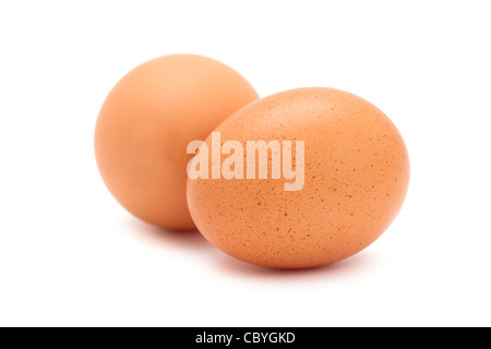 Two fresh brown eggs on white background. Stock Photo