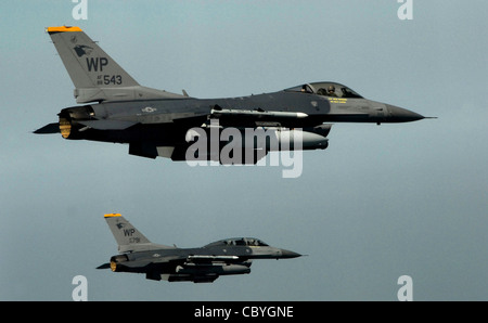 Pilots from the 80th Fighter Squadron fly a training mission over the South Korean peninsula in F-16 Fighting Falcons. Pilots assigned to the 80th FS utilize training missions to simulate actual conditions they may face in combat and keep their war-fighting skills honed. Stock Photo