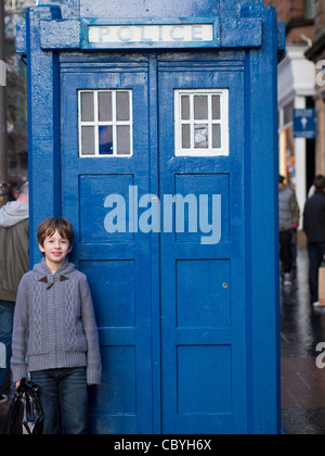 Young Boy and Blue Police Box, Glasgow Stock Photo