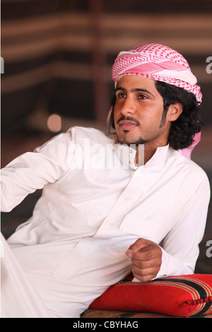 Young Bedouin, nomad arab, in his home tent, in the desert of Wadi Rum, Jordan Stock Photo