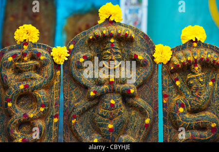 Hindu shrine stone depicting the Indian god Vishnu in the south indian village of Puttaparthi, Andhra Pradesh, India Stock Photo