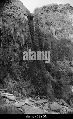 Waterfall cascading from cliffs, Dingle Bay Stock Photo