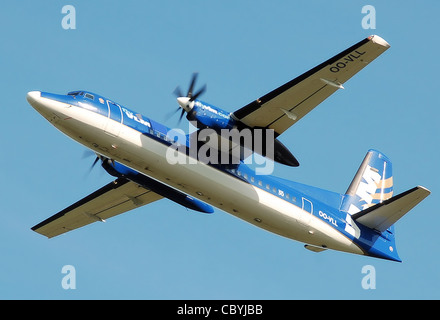 VLM Airlines Fokker 50 (OO-VLL) takes off from Manchester Airport, England. Stock Photo