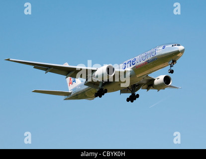 American Airlines Boeing 777-200ER (N791AN), in special Oneworld alliance livery, lands at London Heathrow Airport, England. Stock Photo