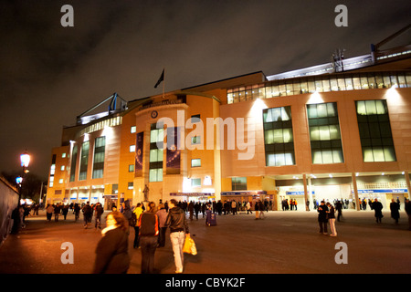 the exterior of stamford bridge football stadium home to chelsea football club at night London England UK United kingdom Stock Photo