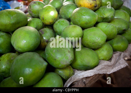 Mangos are for sale in Iganga's central market - Iganga, Uganda, East Africa. Stock Photo