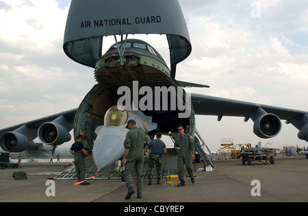 loading  an F-16 Fighting Falcon into a C-5 Galaxy Stock Photo