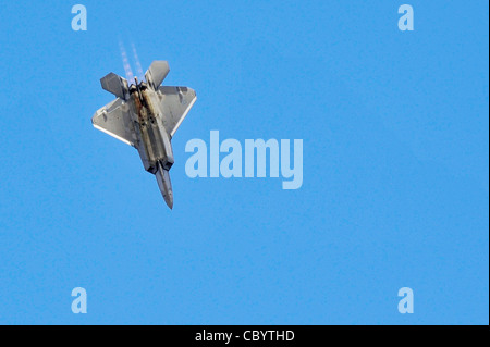 An F-22 Raptor performs a dive Nov. 15, 2009 at the Dubai Air Show in the United Arab Emirates. The F-22 provides the Air Force with a combination of stealth, supercruise, maneuverability and integrated avionics. Stock Photo