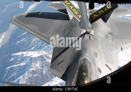 An F-22 Raptor from the 3rd Wing at Elmendorf Air Force Base, Alaska, receives fuel from a KC-135 Stratotanker May 8 during Northern Edge 2008. The exercise, which began May 5 and concludes May 16, is designed to give Soldiers, Sailors, Airmen, Coast Guardsmen and Marines a chance to sharpen their skills prior to facing real-world combat scenarios. The KC-135 is part of the Alaska Air National Guard's 168th Air Refueling Wing from Eielson Air Force Base. Stock Photo