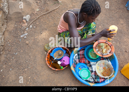Ms. Hawa Samura runs a mobile food stall in Freetown, Sierra Leone, West Africa. Stock Photo