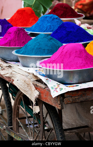 Coloured Indian powder in metal bowls used for making rangoli designs at festivals Stock Photo