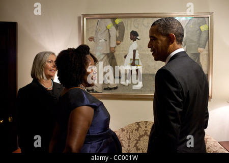 President Barack Obama with Ruby Bridges, who is the little girl portrayed in Normal Rockwell's famous painting, 'The Problem We All Live With,' now on loan to the White House July 15, 2011 in Washington, DC. The painting depicts Ruby as she is escorted to school on the court-ordered first day of in Stock Photo