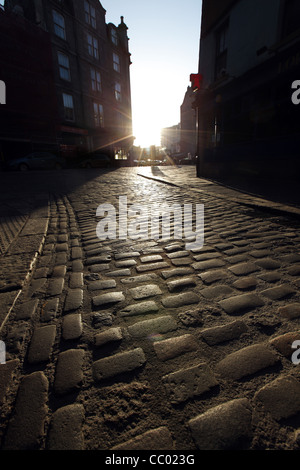 Old cobbles making up the road in the Merchant Quarter of Aberdeen city centre, Scotland, UK Stock Photo