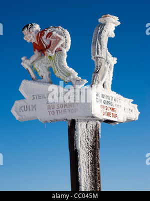 Frozen, snow covered sign post, Mt Rigi, Switzerland Stock Photo