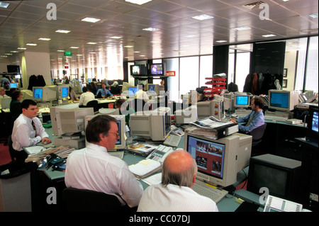 inside the Daily Mirror newspaper editorial offices , Fleet Street during the time that phone hacking was a widespread practice. Piers Morgan can be sitting at the back centre ( blue shirt foot up ) Stock Photo