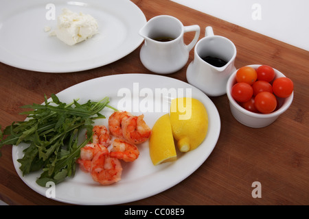 ingredients for a salad with shrimps and lemon Stock Photo