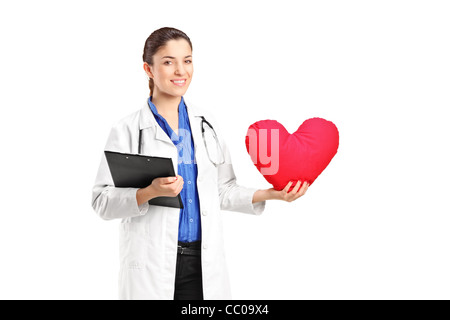 A female doctor holding a red heart Stock Photo