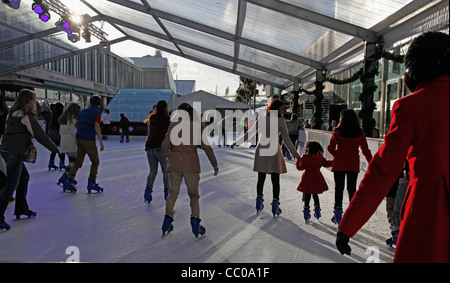 Shoppers ice skating at Westfield shopping mall in Stratford City, by the London 2012 Olympic Park, England, UK Stock Photo