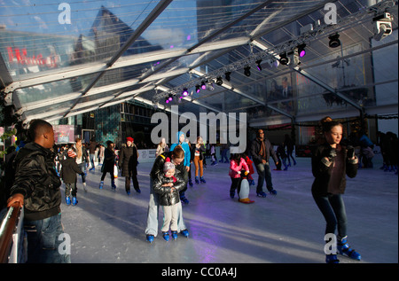 Shoppers ice skating at at Westfield shopping mall in Stratford City, by the London 2012 Olympic Park, England, UK Stock Photo