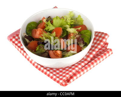 Fresh Healthy Tomato and Lettuce Salad Against A White Background With No People And A Clipping Path Stock Photo