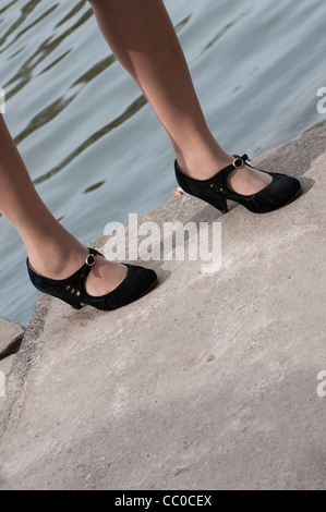 Woman standing on the harbour Stock Photo