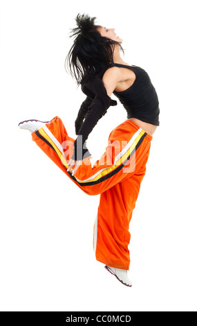 Woman dancer in jumping pose expressing positivity Stock Photo