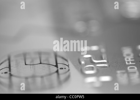 Black and white macro images of debit card. Focus on numbers and Chip. Stock Photo