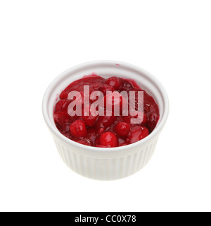 Fresh homemade cranberry sauce in a ramekin isolated against white Stock Photo