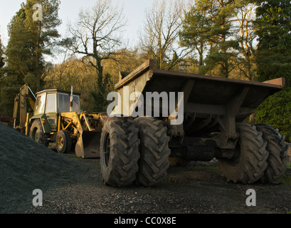 massey ferguson backhoe loader and four wheel drive dumper Stock Photo