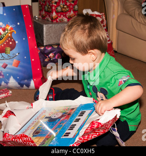 2 Year Old Young Child Boy Infant Toddler Opening A Xmas Christmas Present Presents Stock Photo