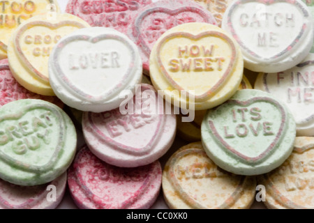 Love Heart Sweets with messages to loved ones on them Stock Photo - Alamy