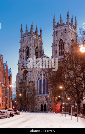 York Minster west entrance at dusk after snow, seen from Duncombe Place. York. Stock Photo