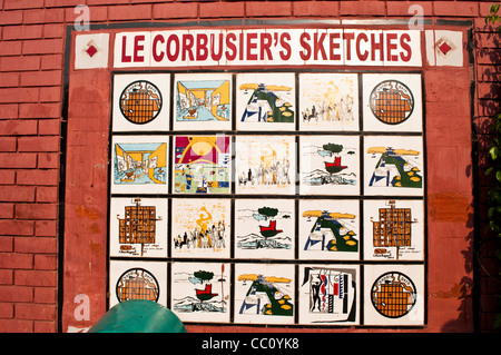 Display of replicas of Le Corbusier's sketches on a tiled wall near Sukhna lake, Chandigarh, India Stock Photo