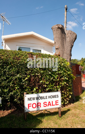 For sale sign outside a caravan on a static caravan park in England. Stock Photo