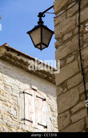 Old street lamp and shuttered window in Vezenobres Languedoc-Roussillon France Stock Photo