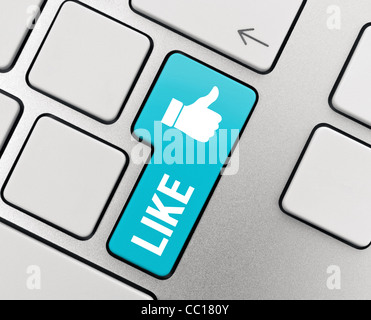 Like text with thumb up symbol on modern aluminum keyboard. Social Media conceptual image. Stock Photo