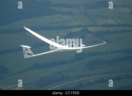 Twin seats glider plane ASH-25 flying over Lorraine region, France Stock Photo