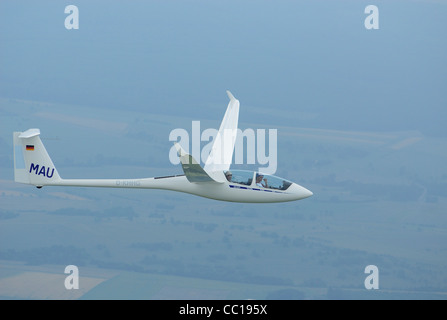 Twin seats glider plane ASH-25 flying over Lorraine region, France Stock Photo