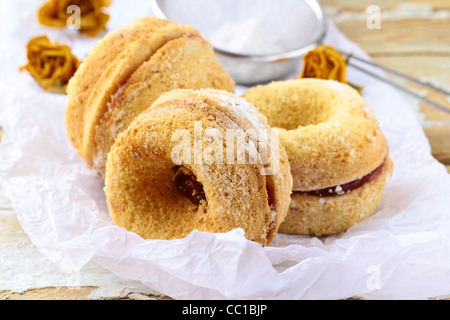 Freshly baked doughnuts sprinkled with icing sugar Stock Photo