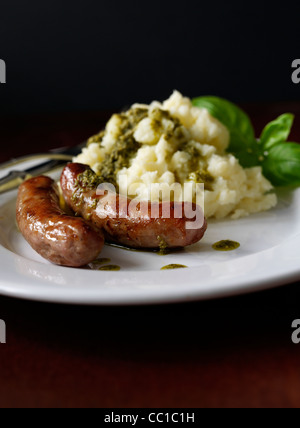 sausages and mash served with salsa verde Stock Photo