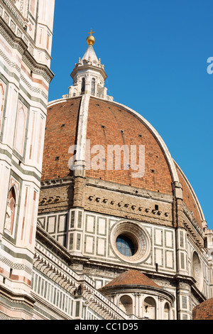 Florence Cathedral of Santa Maria del Fiore or Duomo di Firenze, detail of Brunelleschi's dome against the blue sky. Stock Photo