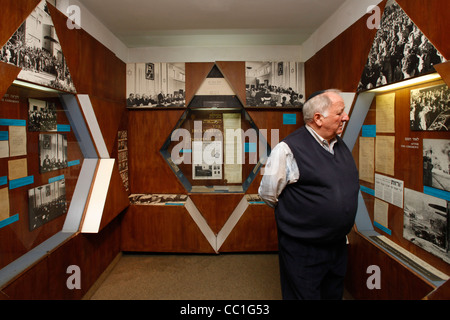 A visitor views historic documents and photographs displayed at the showroom inside the Independence Hall the site of the signing of Israel's Declaration of Independence in Tel Aviv Stock Photo