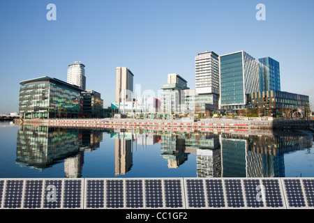 Media city the home of the BBC in the north at Salford Quays, Manchester, UK, reflected in the Manchester Ship Canal. Stock Photo