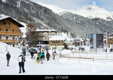 Village scene with skiers in Austrian alpine ski resort with snow in winter in St Anton am Arlberg, Tyrol, Austria. Stock Photo