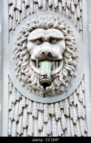 Lion head water pump spout sculpture in Bruges Belgium Stock Photo