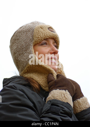 woman, girl in warm winter clothes on white background Stock Photo