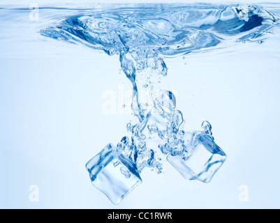 A background of bubbles forming in blue water after ice cubes are ...