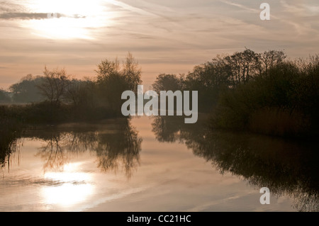 A MISTY MORNING ON THE NORFOLK BROADS ON THE RIVER ANT AT DAWN. Stock Photo